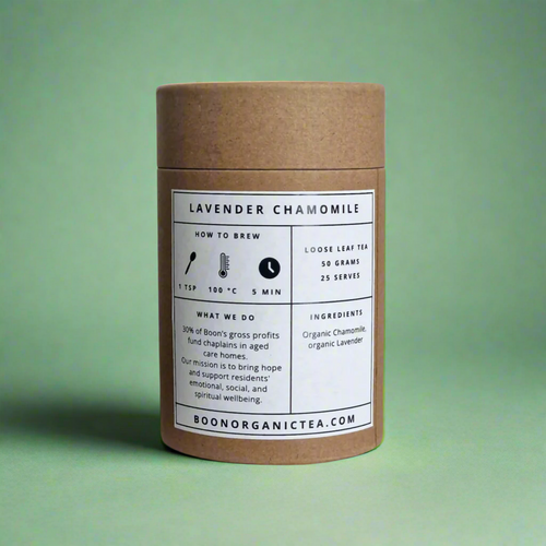 Cardboard tea canister lavender chamomile organic tea with a label on a green background