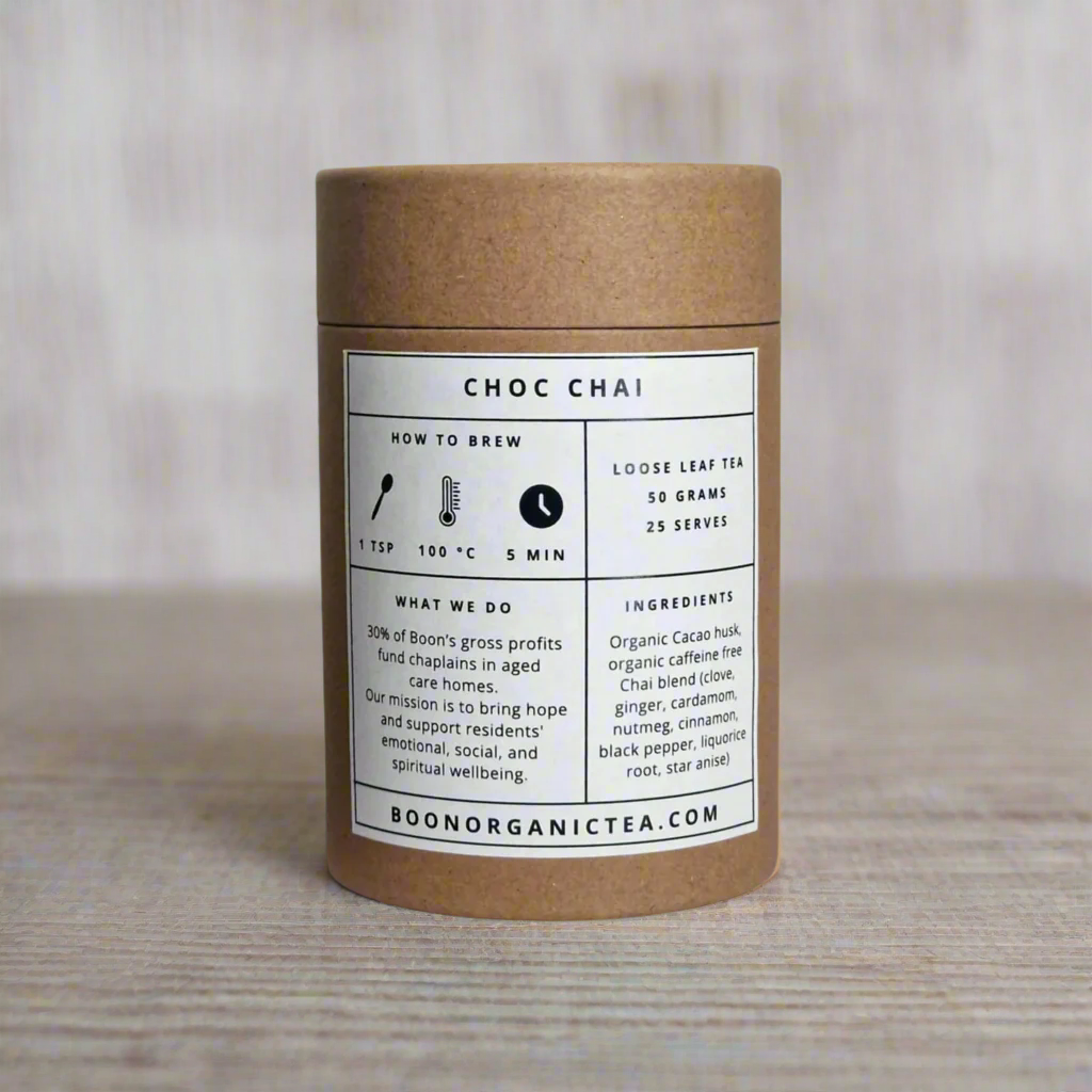 Kraft paper tea canister with 'Choc Chai' label on a teal background