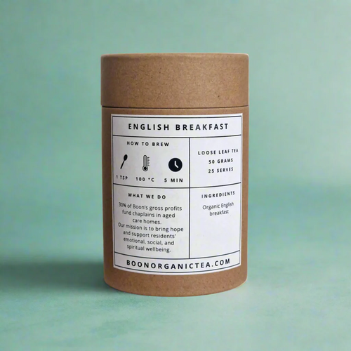 Kraft paper tea canister  english breakfast organic tea with a label on a green background